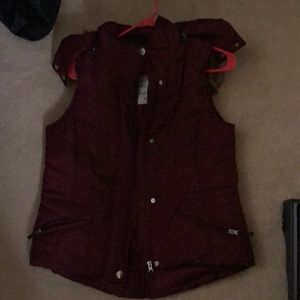 Francesca’s red sleeveless vest with faux fur